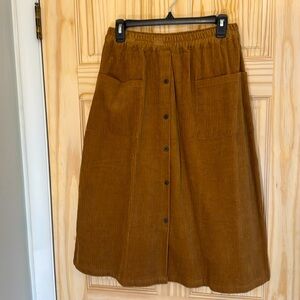 Brown corduroy skirt with pockets. Never worn.